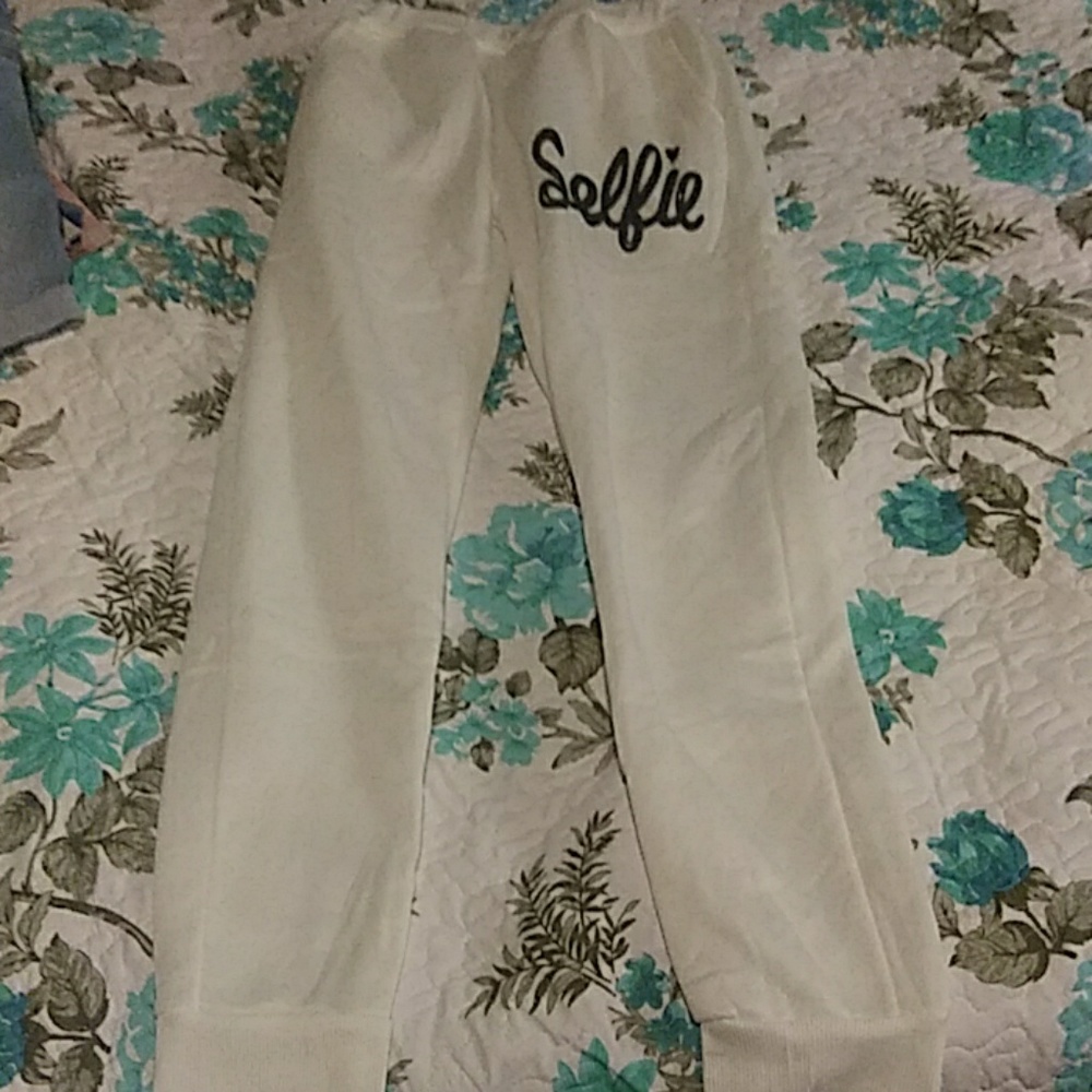 White sweats with the wors"SELFIE" on them